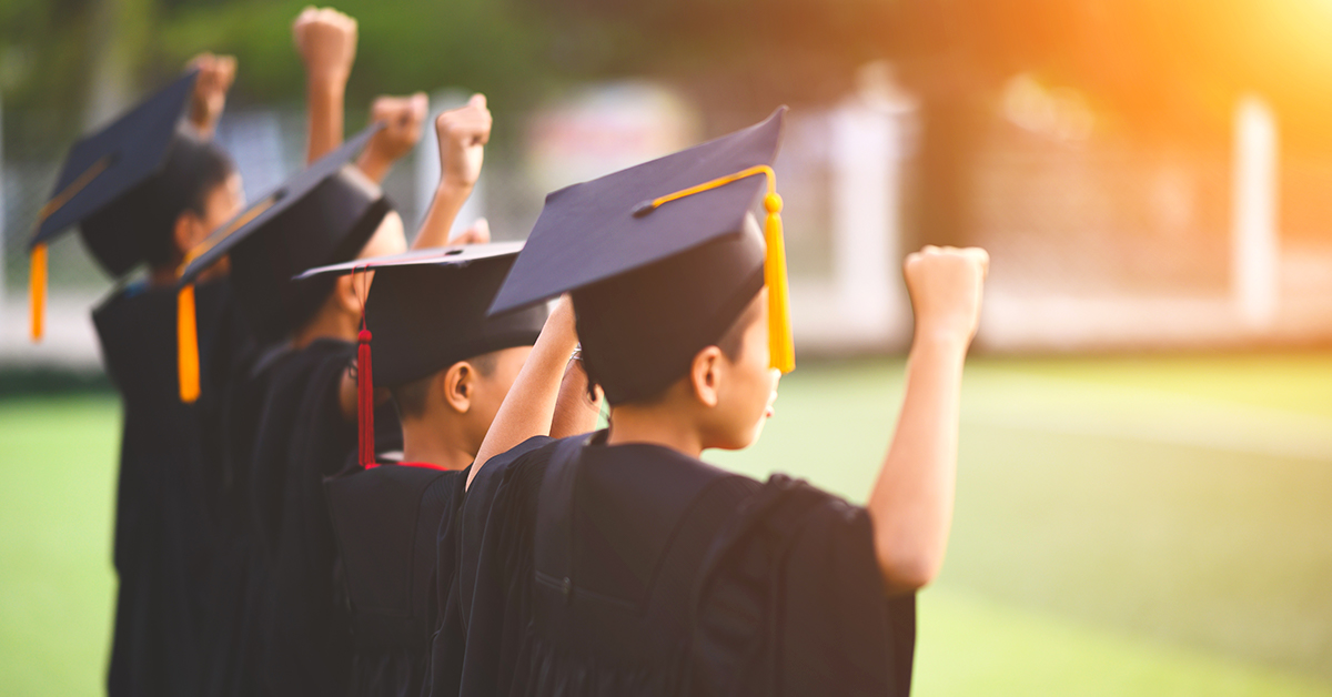 A photo of children in caps and gowns