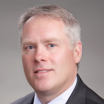 This is a professional head shot image of Kelley Biography.