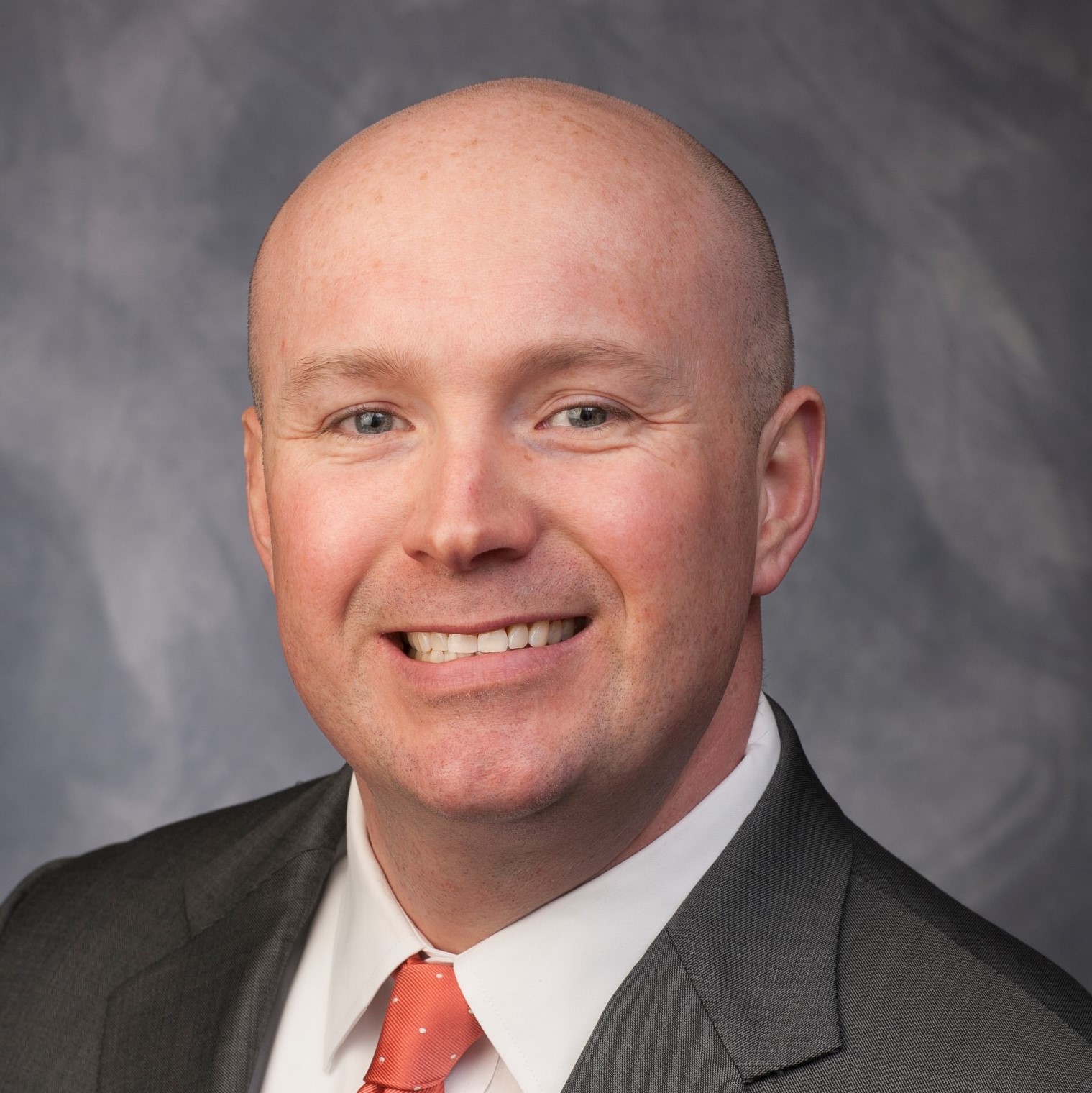 This is a professional head shot image of Sykes Biography.