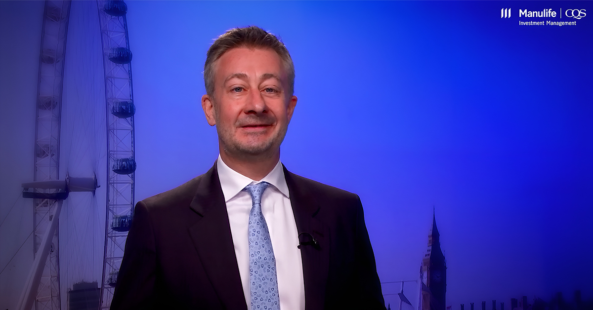 Professional portrait of a young businessman in a suit, facing forward with a neutral background.