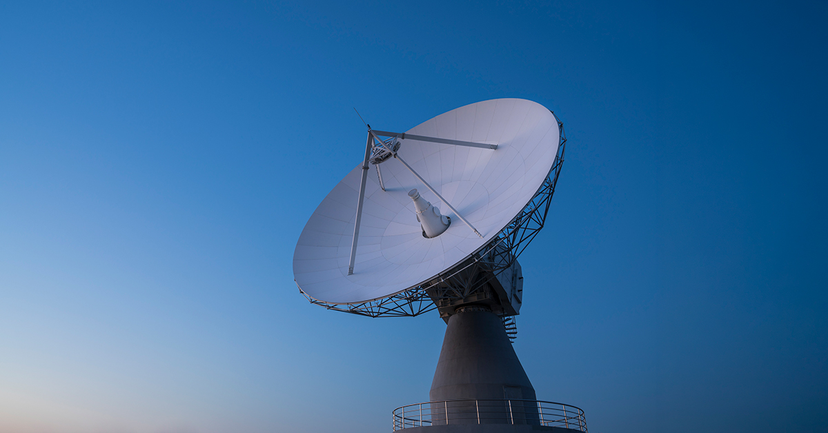Landscape with a parabolic dish antenna and telescope at the dish vertex tracking a satellite and astronomical object.