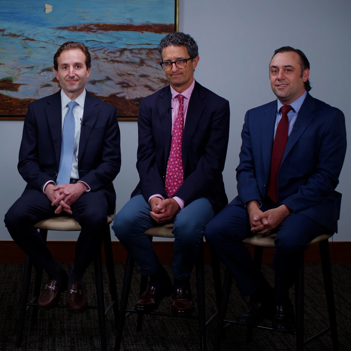 A group of businessmen collaborates in a professional office setting, emphasizing teamwork and corporate success.