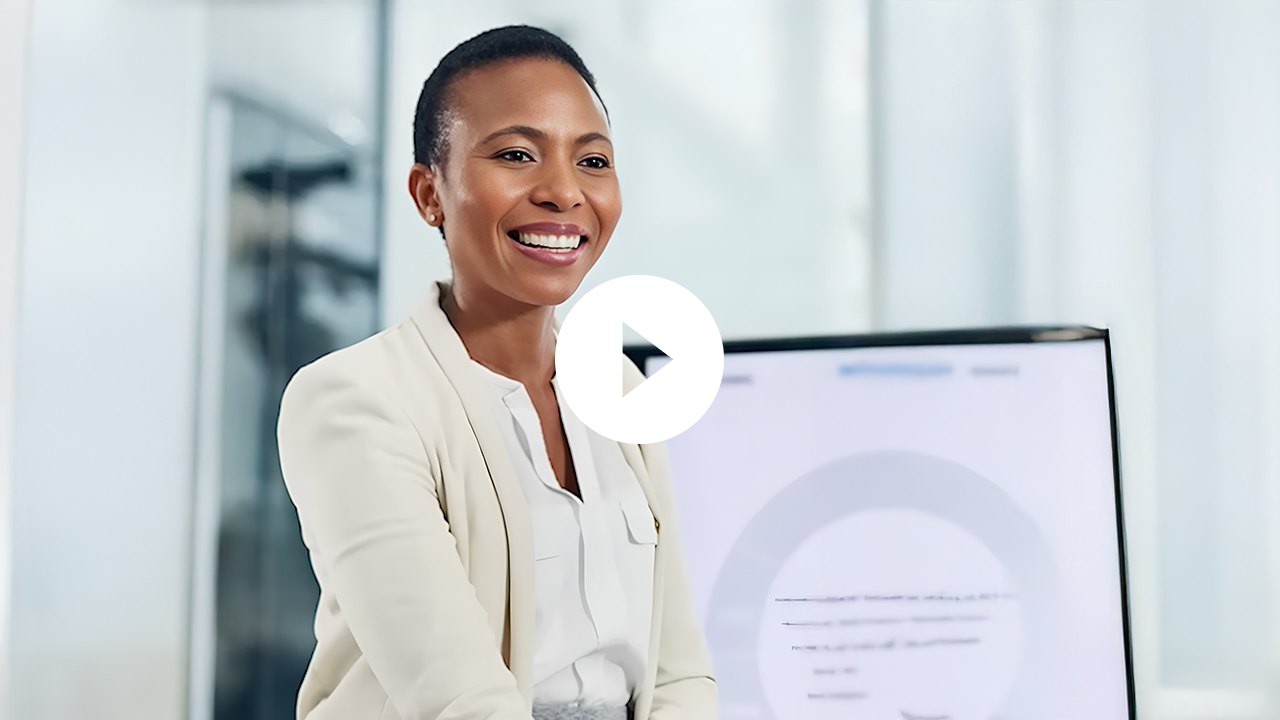 A smiling female doctor poses confidently in a professional office setting, radiating a sense of expertise and approachability.