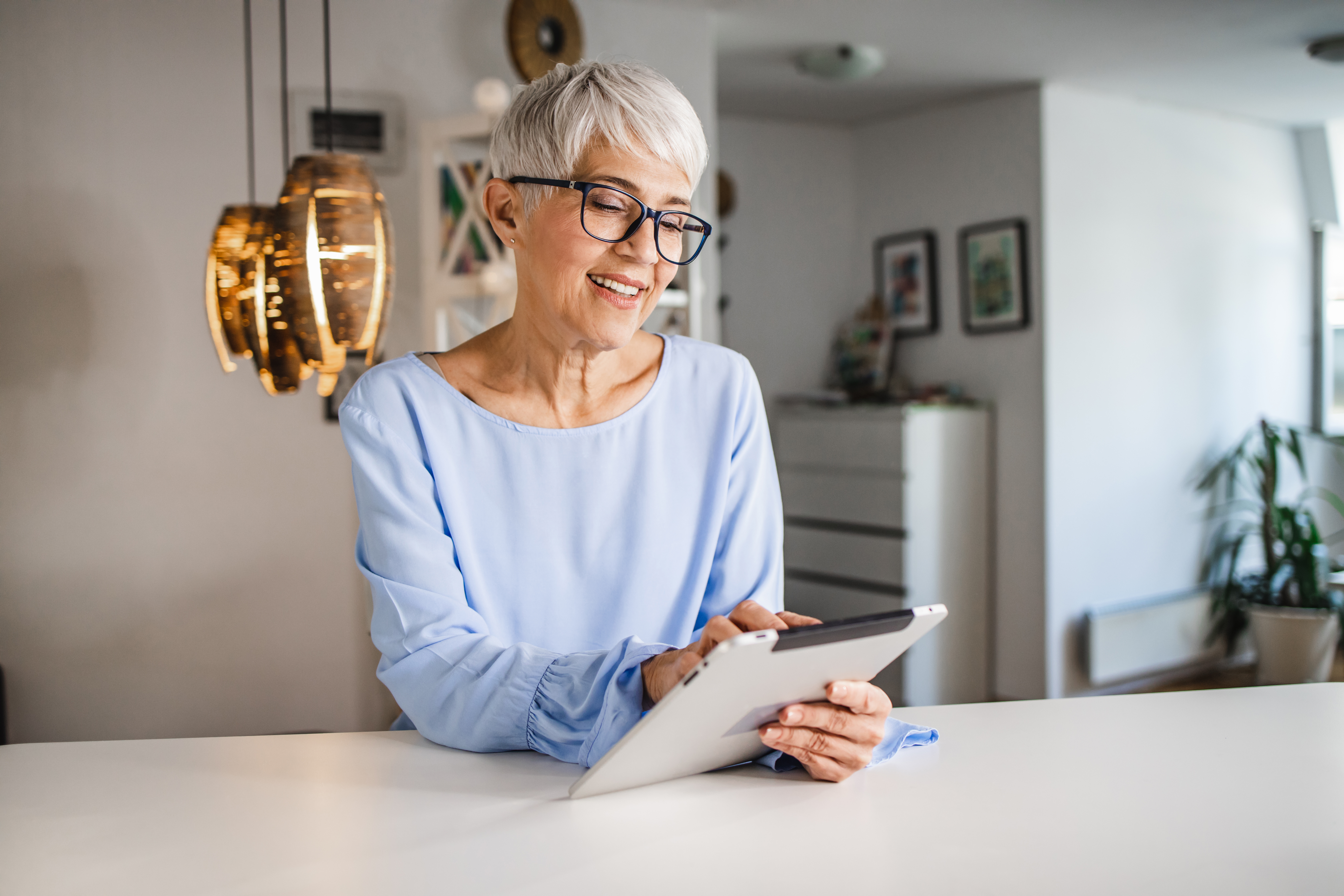 Group of professionals in a modern kitchen setting, engaging in a collaborative and positive discussion indoors.