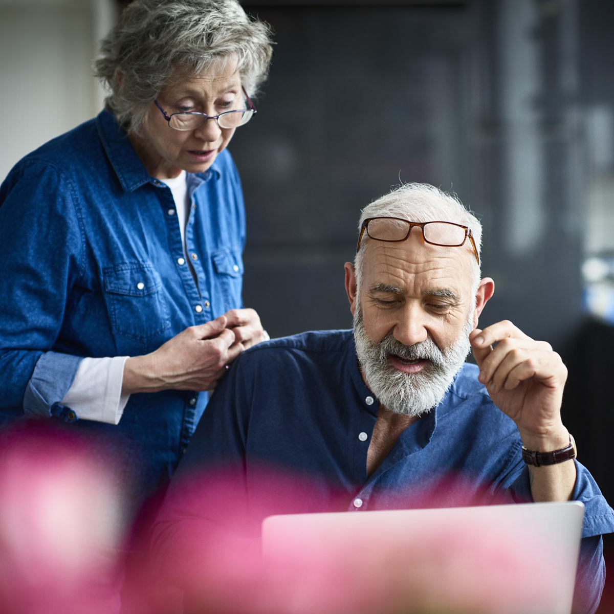 A professional portrait of an elderly businessman, showcasing a confident and experienced senior male in a formal setting.