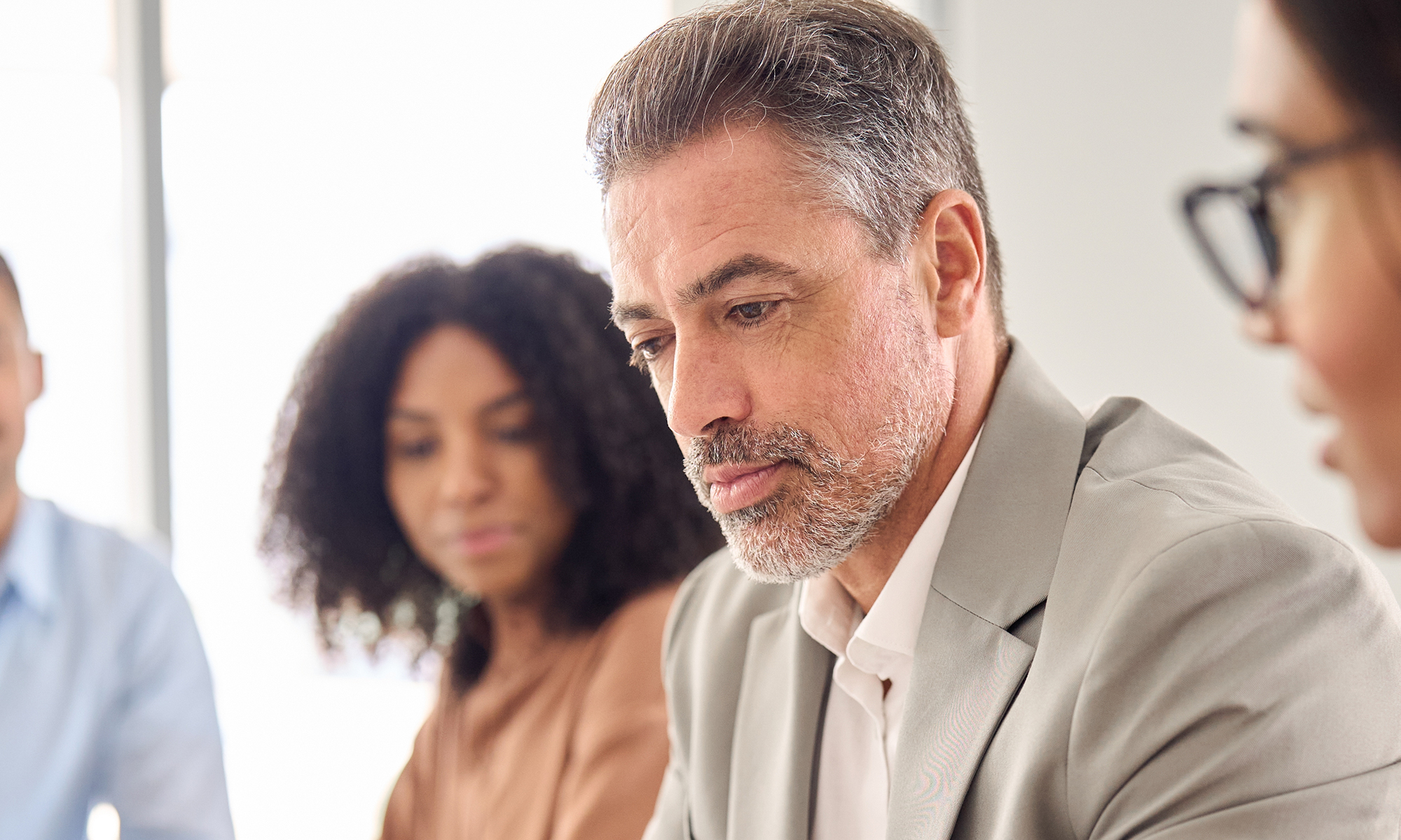 Close-up of a business man in a meeting. 