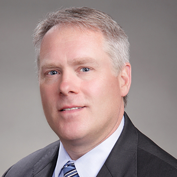 This is a professional head shot image of Kelley Biography.