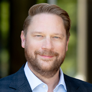This is a professional head shot image of Alex Grassino.