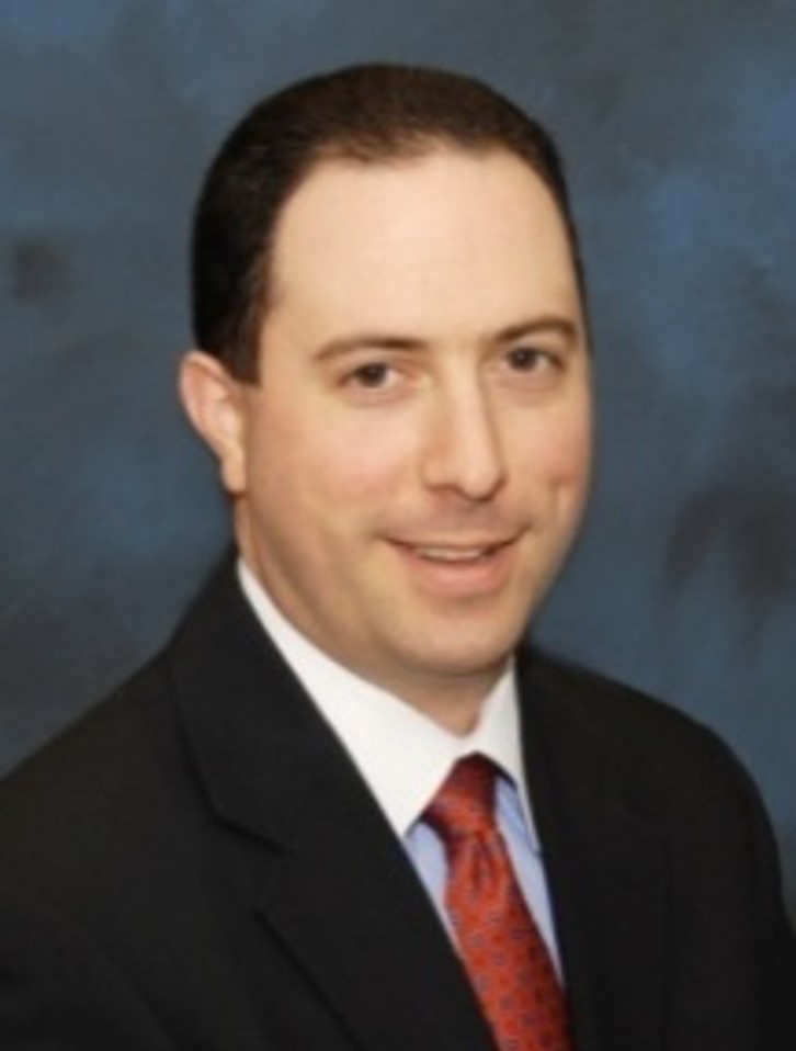 A young businessman is portrayed in a professional setting, impeccably dressed in a suit, exemplifying adult male elegance.